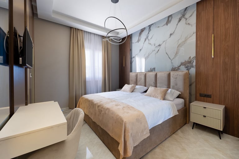 Modern bedroom with marble accent wall