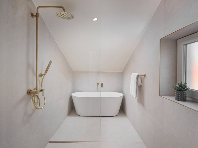 Modern minimalist bathroom with white freestanding tub, brass shower fixtures, tile walls, and window with potted plant