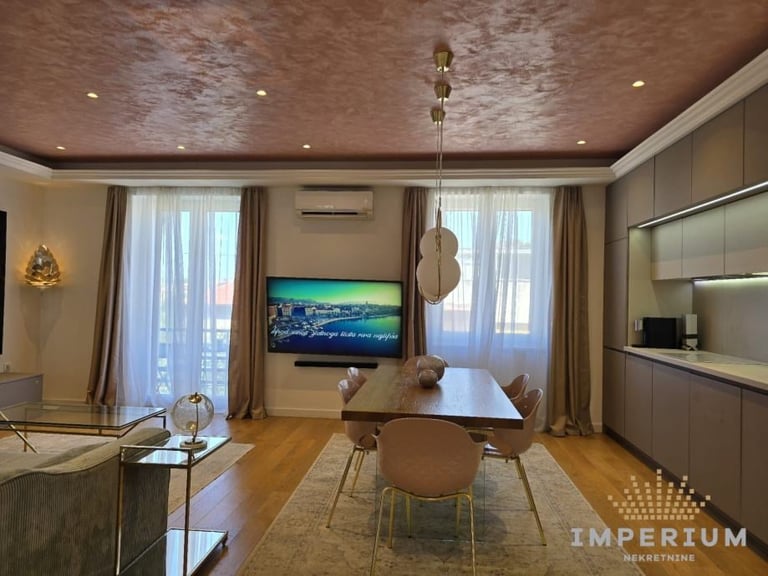 Modern living room with dining table, wall-mounted TV, textured ceiling, floor-to-ceiling windows, and contemporary furnishings